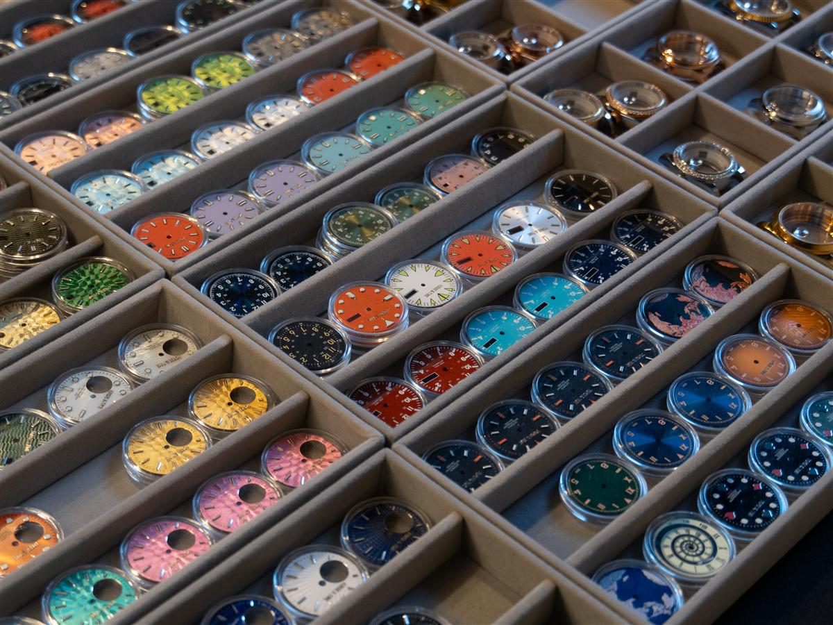 Trays of colourful watch dials
