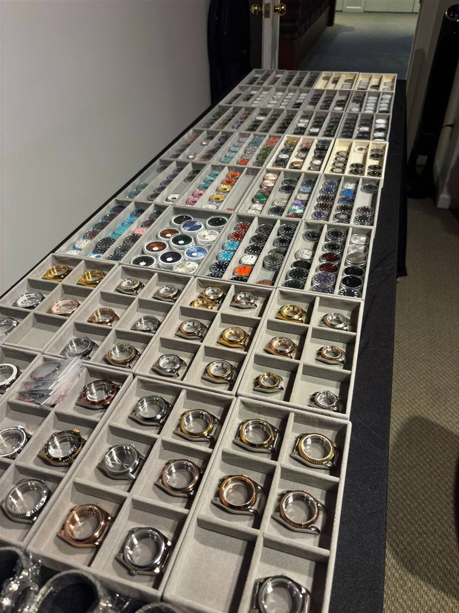 Trays of watch cases and parts ready for guests to choose from